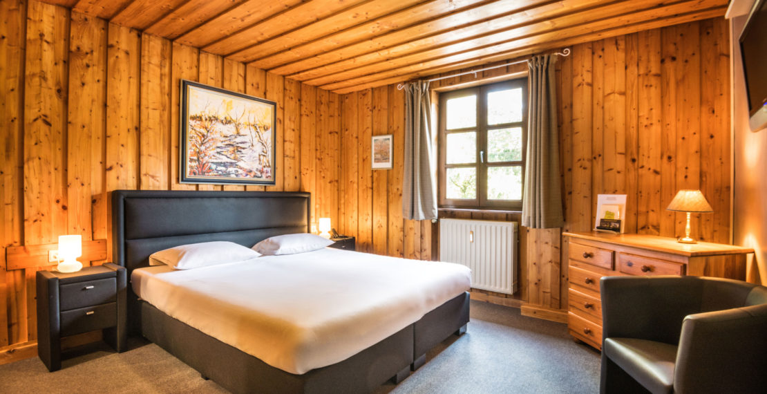 Double room with wooden furniture