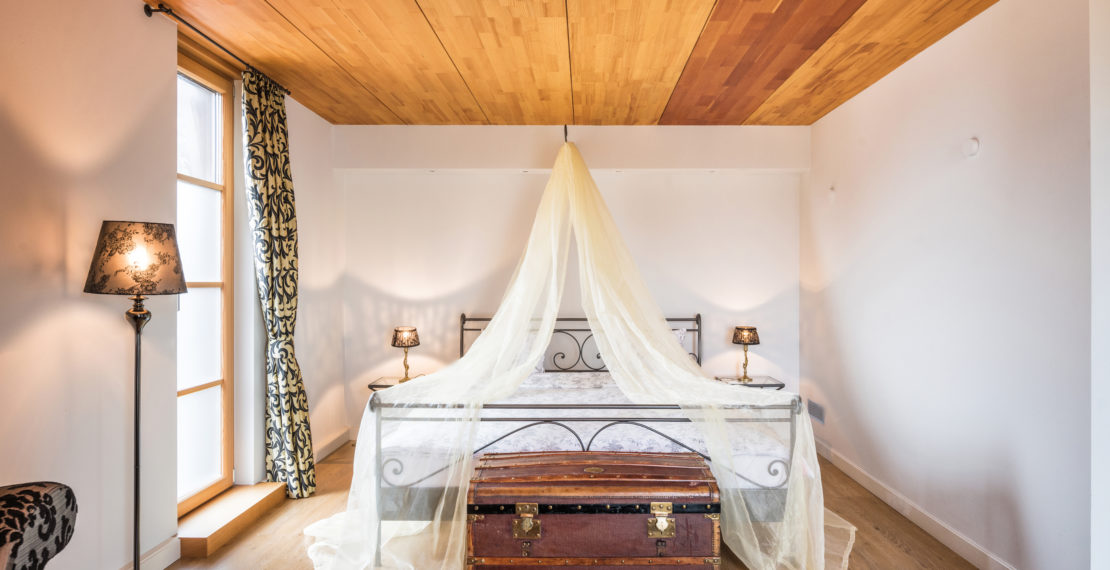 Double bed covered with a veil